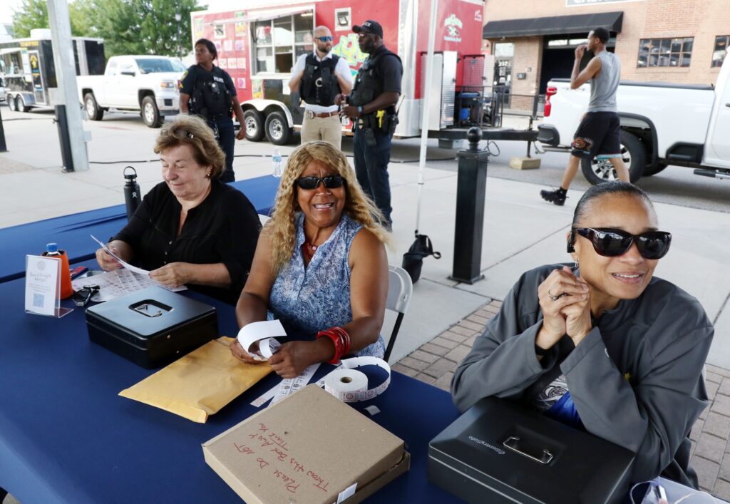 volunteers checking I.D.'s at gig in the park concert
